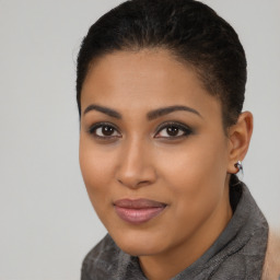 Joyful latino young-adult female with short  brown hair and brown eyes