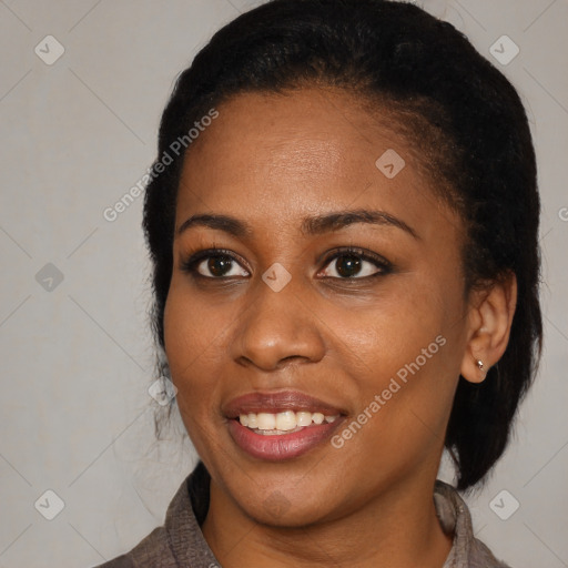 Joyful black young-adult female with medium  black hair and brown eyes