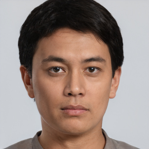 Neutral asian young-adult male with short  brown hair and brown eyes