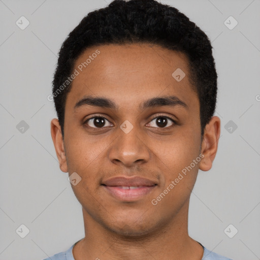 Joyful black young-adult male with short  black hair and brown eyes