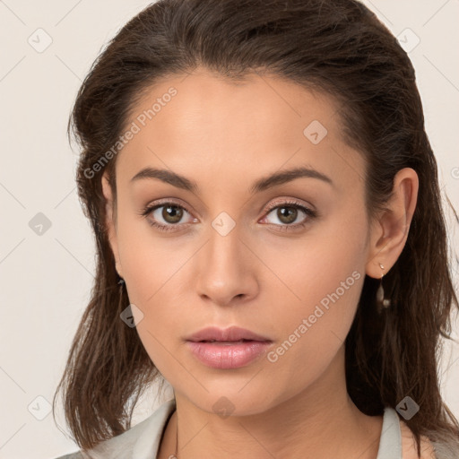 Neutral white young-adult female with long  brown hair and brown eyes