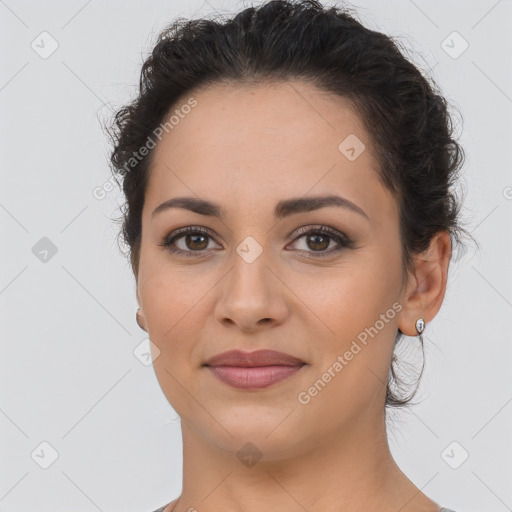 Joyful latino young-adult female with short  brown hair and brown eyes