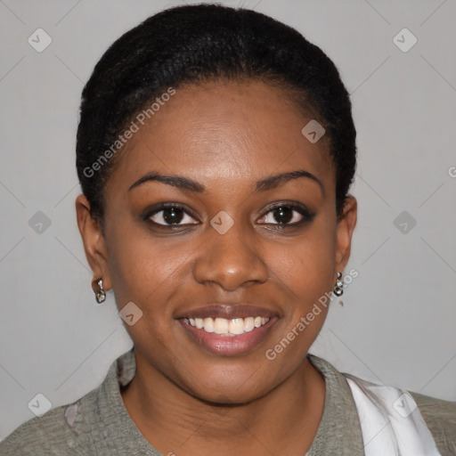 Joyful black young-adult female with short  brown hair and brown eyes