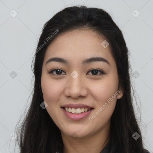 Joyful asian young-adult female with long  brown hair and brown eyes