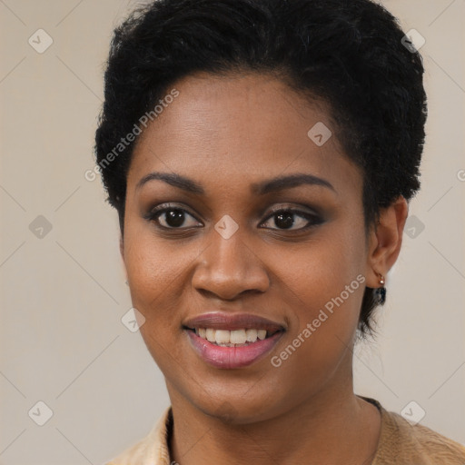 Joyful black young-adult female with short  black hair and brown eyes