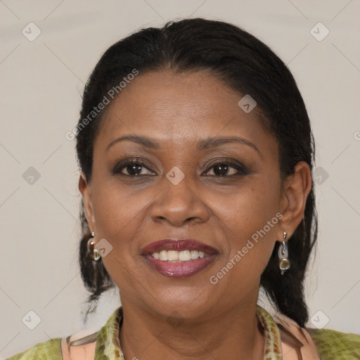 Joyful latino adult female with medium  brown hair and brown eyes