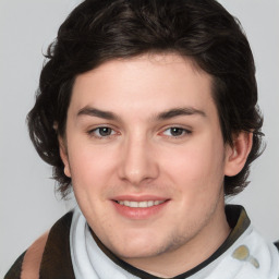 Joyful white young-adult male with medium  brown hair and brown eyes