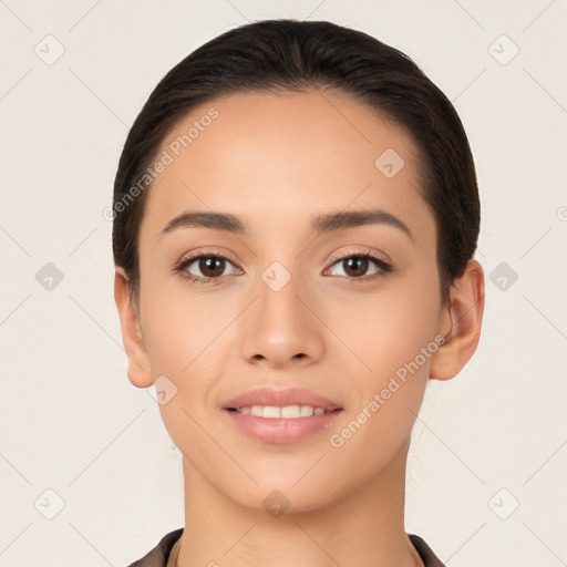 Joyful white young-adult female with long  black hair and brown eyes