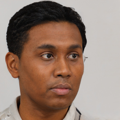 Neutral black young-adult male with short  brown hair and brown eyes