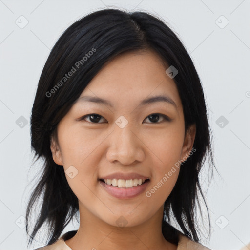 Joyful asian young-adult female with medium  black hair and brown eyes