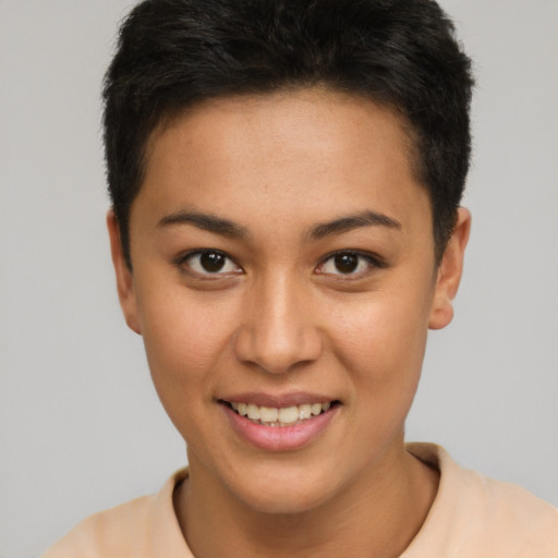 Joyful latino young-adult female with short  brown hair and brown eyes
