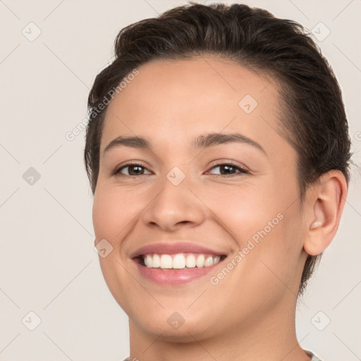 Joyful white young-adult female with short  brown hair and brown eyes