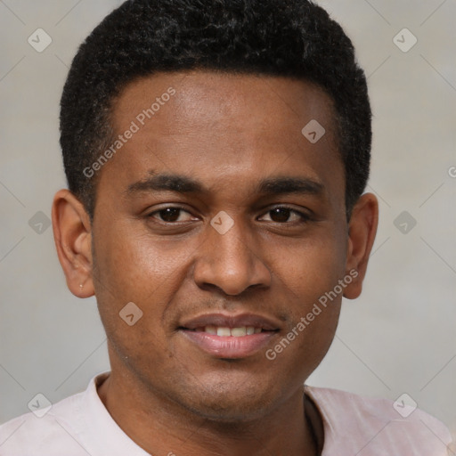 Joyful black young-adult male with short  black hair and brown eyes