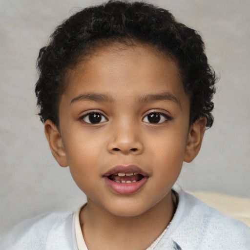 Joyful latino child female with short  brown hair and brown eyes