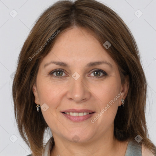 Joyful white adult female with medium  brown hair and grey eyes