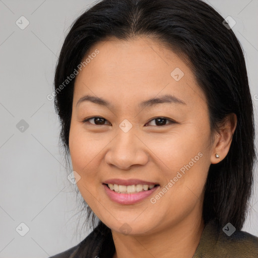 Joyful asian young-adult female with long  brown hair and brown eyes