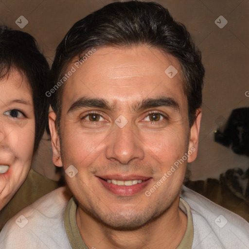 Joyful white adult male with short  brown hair and brown eyes