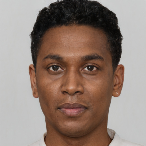 Neutral black young-adult male with short  black hair and brown eyes