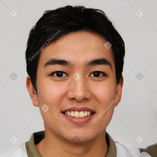 Joyful asian young-adult male with short  black hair and brown eyes