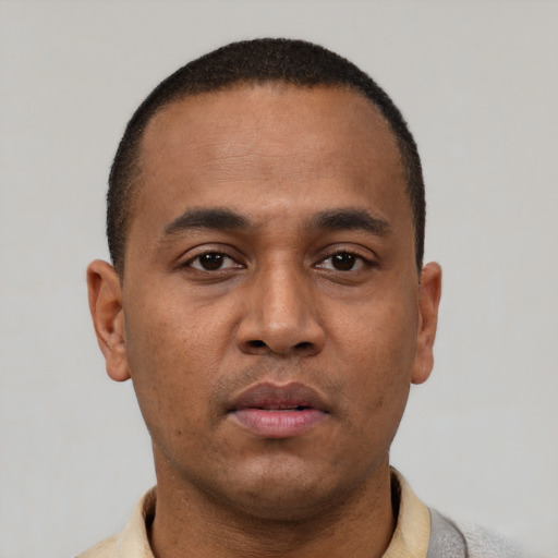 Neutral latino young-adult male with short  brown hair and brown eyes