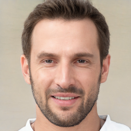 Joyful white young-adult male with short  brown hair and brown eyes