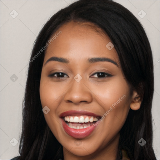 Joyful latino young-adult female with long  brown hair and brown eyes