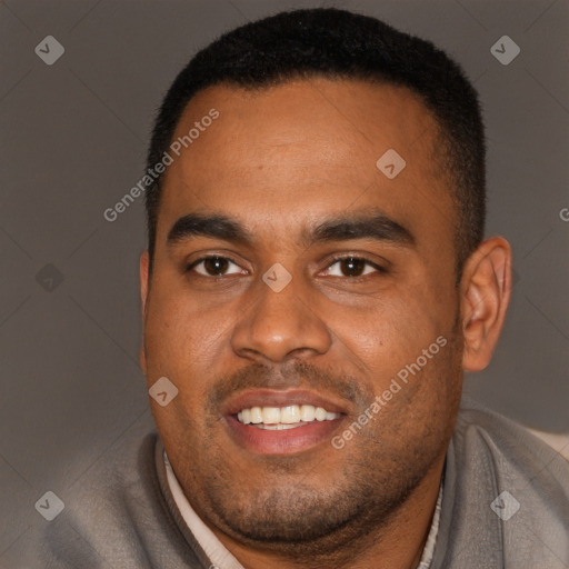 Joyful black young-adult male with short  brown hair and brown eyes