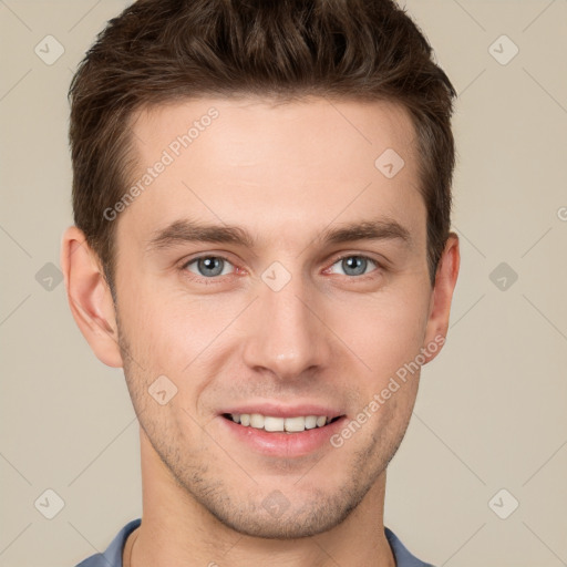 Joyful white young-adult male with short  brown hair and grey eyes