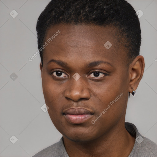 Joyful black young-adult female with short  black hair and brown eyes