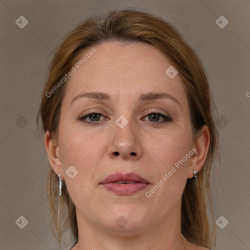 Joyful white adult female with medium  brown hair and brown eyes