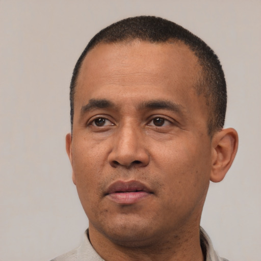 Neutral latino adult male with short  black hair and brown eyes