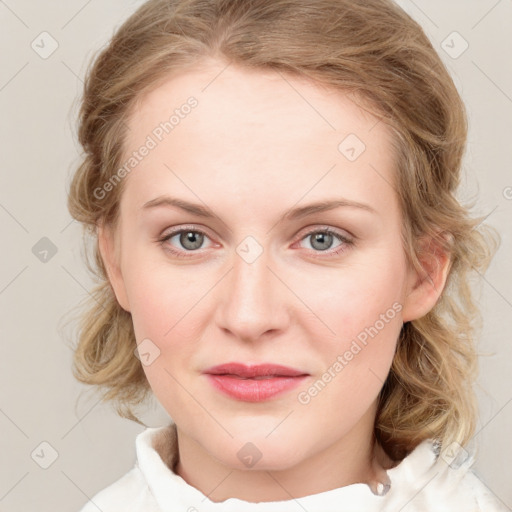 Joyful white young-adult female with medium  brown hair and blue eyes