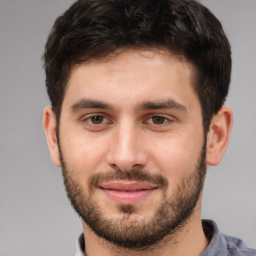 Joyful white young-adult male with short  brown hair and brown eyes