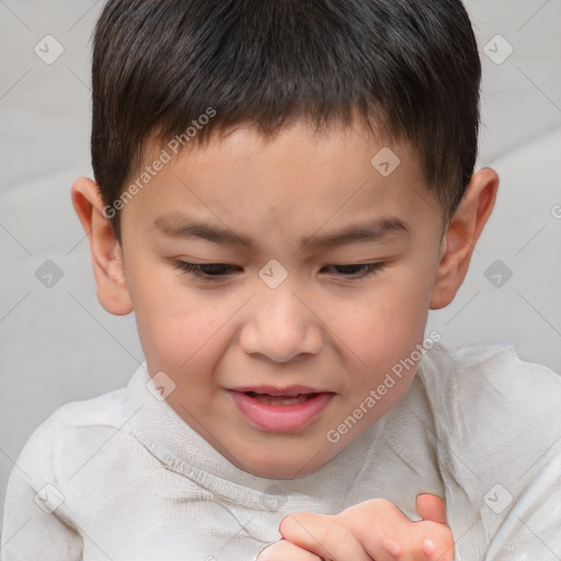 Joyful white child male with short  brown hair and brown eyes