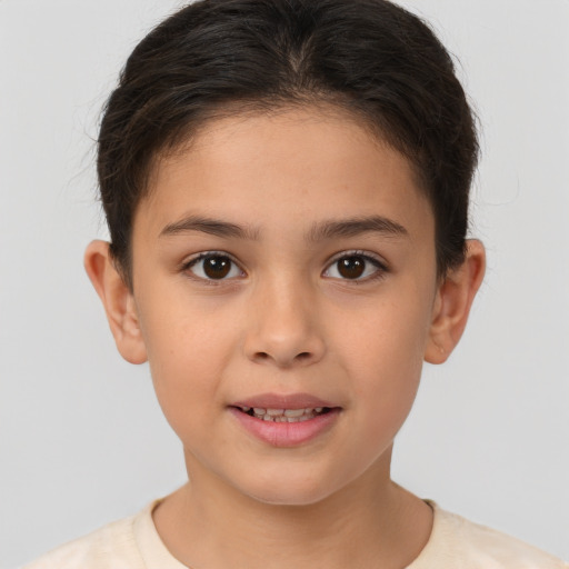 Joyful white child female with short  brown hair and brown eyes