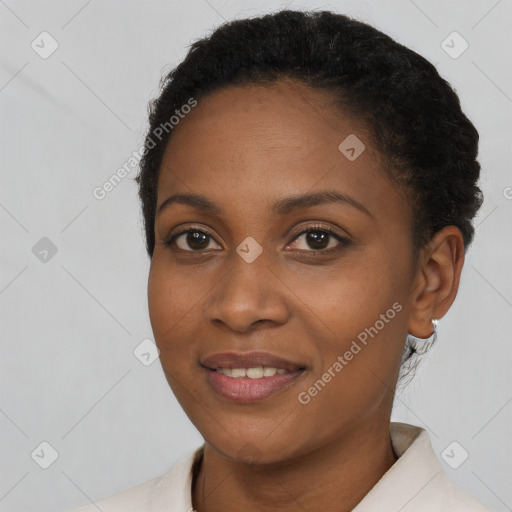 Joyful black young-adult female with short  brown hair and brown eyes