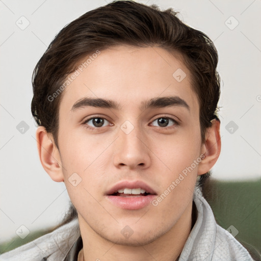 Neutral white young-adult male with short  brown hair and brown eyes