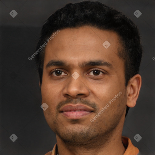 Joyful latino young-adult male with short  black hair and brown eyes