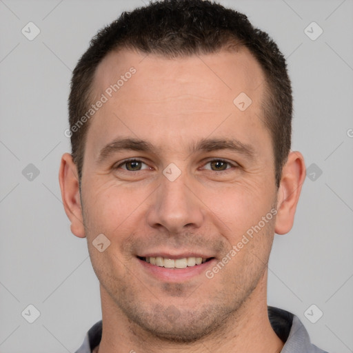 Joyful white young-adult male with short  brown hair and brown eyes