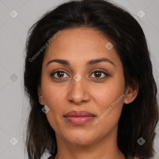 Joyful latino young-adult female with long  brown hair and brown eyes