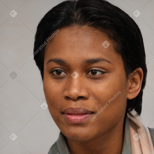 Joyful black young-adult female with short  black hair and brown eyes