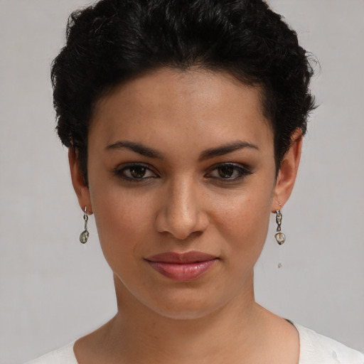 Joyful latino young-adult female with short  brown hair and brown eyes