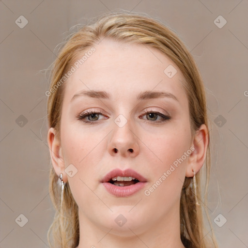 Joyful white young-adult female with medium  brown hair and blue eyes