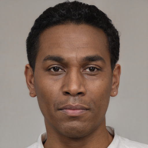 Neutral black young-adult male with short  black hair and brown eyes