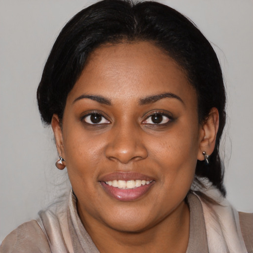 Joyful latino young-adult female with medium  black hair and brown eyes