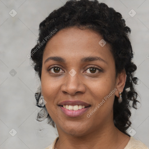 Joyful black young-adult female with short  brown hair and brown eyes