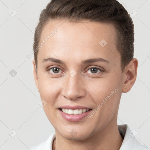 Joyful white young-adult female with short  brown hair and brown eyes