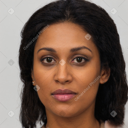 Joyful latino young-adult female with long  brown hair and brown eyes