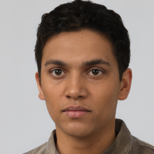 Neutral latino young-adult male with short  black hair and brown eyes