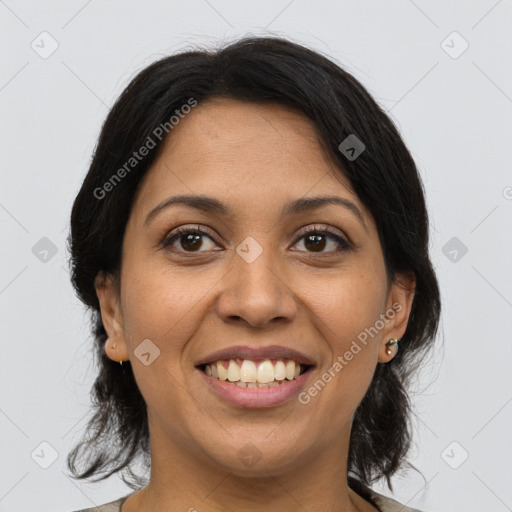 Joyful latino young-adult female with medium  brown hair and brown eyes